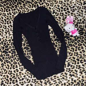 y2k inspired black form fitting long sleeve top